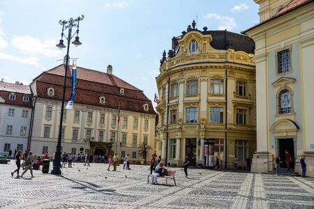 Sibiu, Romania - 2019. Tourists wandering in The Big Square of Sibiu (Piata Mare).のeditorial素材
