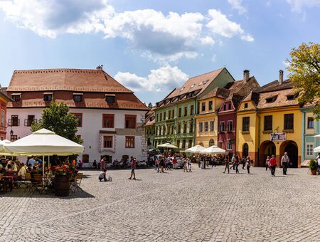 Sighisoara, Romania - 2019. People having lunch and wandering on the streets of Sighisoara old town.のeditorial素材