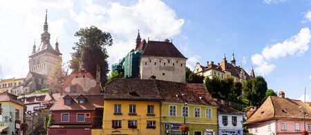 Sighisoara, Romania - 2019. Beautiful view of colorful houses and Tower Clock (Turnul cu ceas) in Sighisoara citadel.のeditorial素材