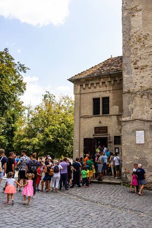 Sighisoara, Romania - 2019. Tourists waiting in line to visit the History Museum in Sighisoara citadel.のeditorial素材