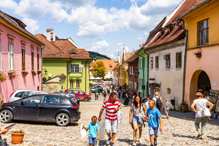 Sighisoara, Romania - 2019. People wandering on the streets of Sighisoara citadel (old town)....