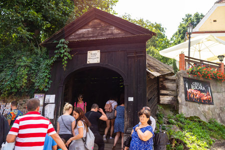 Sighisoara, Romania - 2019. Tourists waiting in line to visit the Covered Stairway in Sighisoara citadel.のeditorial素材