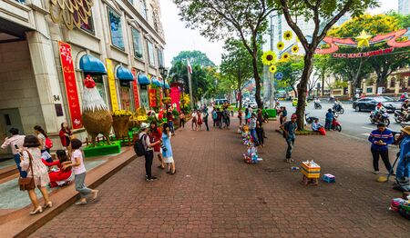Ho Chi Minh City, Vietnam â 2019. Locals gathering on the streets of the old town of Ho Chi Minh.のeditorial素材