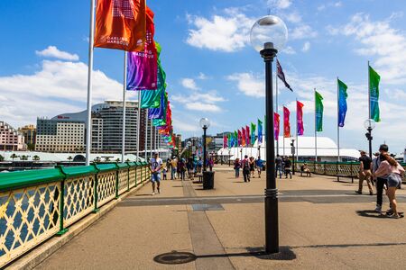Sydney, Australia - 2019. Tourists crossing the Darling Harbor, one of the main attractions of Sydney city.のeditorial素材