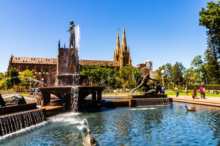 Sydney, Australia - 2019. Archibald Memorial Fountain in Hyde Park, Theseus conquering the Minotaur & Cathedral.のeditorial素材