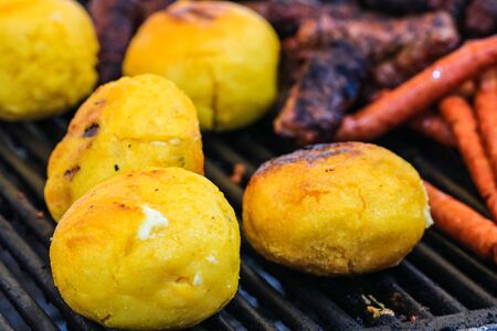 Close up of romanian traditional grilled polenta with cheese, named "bulz". Specific Transylvania, Romania.の写真素材