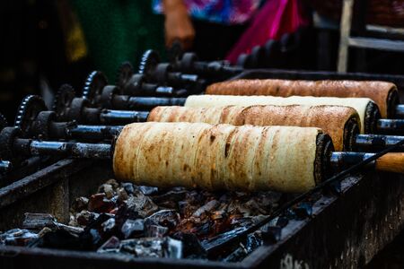 Preparation of the famous, traditional and delicious Hungarian Chimney Cake Kurtos Kolacs (KÃ¼rtÅ‘skalÃ¡cs)の素材 [FY310129990548]