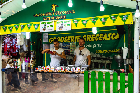Chefs making and selling Greek donuts, loukoumades at a food festival in Bucharest, Romania â 2019のeditorial素材