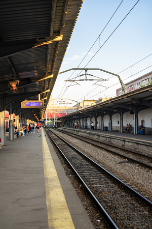 Travelers waiting for a train, on the platform of Bucharest North Railway Station (Gara de Nord) in Bucharest, Romania, 2019のeditorial素材