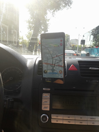 An Nokia phone with Waze navigation app inside the car in traffic, in Bucharest, Romania, 2019のeditorial素材