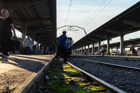 Travelers waiting for a train, on the platform of Bucharest North Railway Station (Gara de Nord) in Bucharest, Romania, 2019のeditorial素材