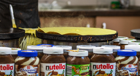 Chefs making and selling crepes, pancakes at a food festival in Bucharest, Romania  2019のeditorial素材