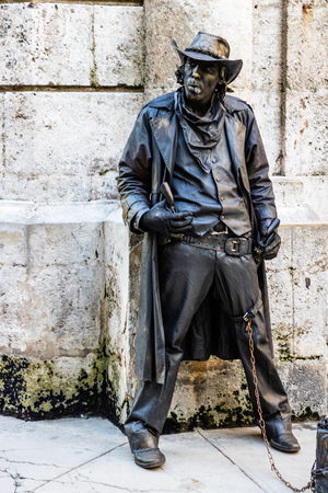 Havana, Cuba â 2019. Man dressed as cowboy gives live statue performance on the streets of Havana.のeditorial素材