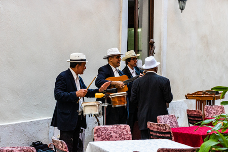 Havana, Cuba â 2019. Street musicians playing traditional Cuban music in a local restaurant in Havana.のeditorial素材