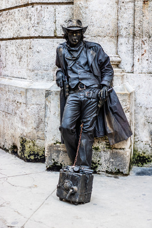 Havana, Cuba â 2019. Man dressed as cowboy gives live statue performance on the streets of Havana.のeditorial素材