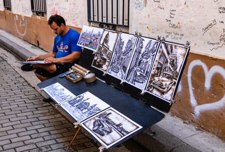 Havana, Cuba  2019. Local artist drawing souvenirs on the streetのeditorial素材