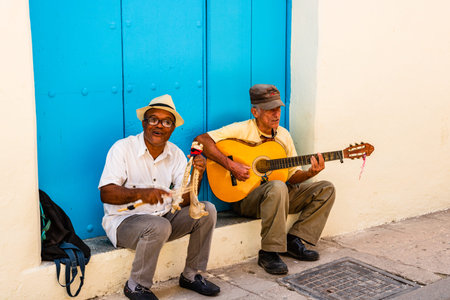 Havana, Cuba â 2019. Two street musicians playing traditional Cuban music on the street in Havana.のeditorial素材