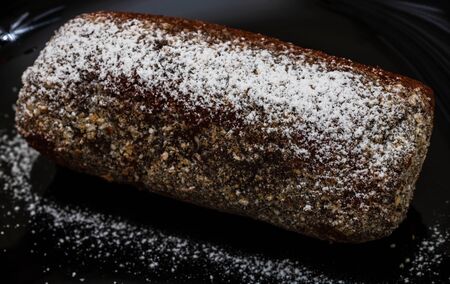Cocoa cake with sugar powder. Close up photo.の写真素材