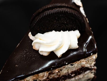Creamy cheesecake with chocolate cookies and cream biscuits.の写真素材