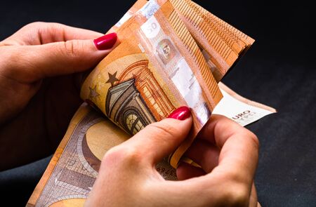 Woman counting money, counting EURO close upの写真素材