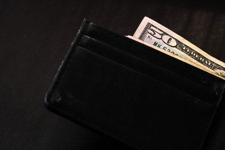 Man wallet with money on the table, wallet with dollars