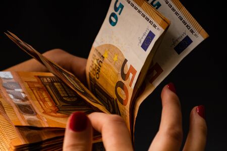 Woman counting money, counting EURO close upの写真素材
