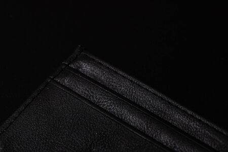 Empty wallet on black table backgroundの写真素材