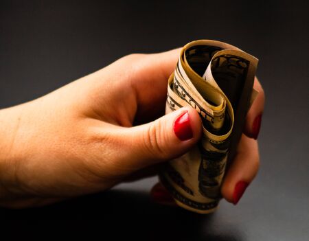 Woman counting money, counting dollars close upの写真素材