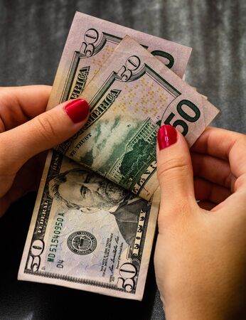 Woman counting money, counting dollars close upの写真素材