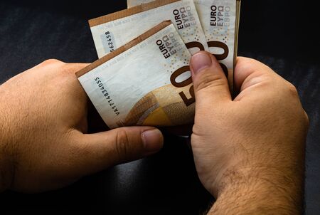 Man counting money, counting EURO close upの写真素材