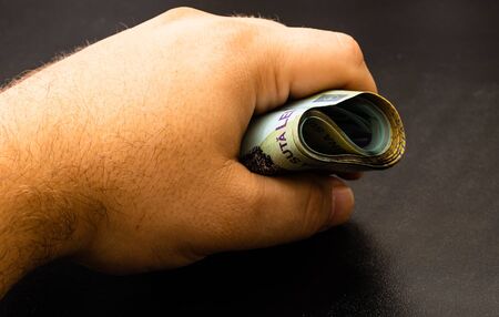 Man counting money, counting LEI close upの写真素材