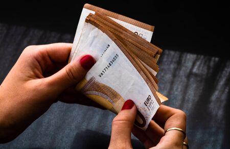 Woman counting money, counting EURO close upの写真素材