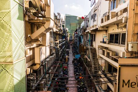 A lot of parked scooters and motorcycles in the Pathum Wan district of Bangkok. Bangkok, Thailand, 2019.のeditorial素材