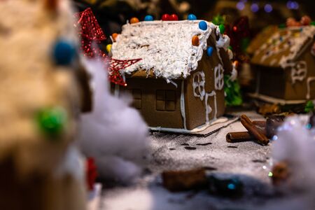 Christmas decorations against blurred background. Ginger houses with candies.の写真素材