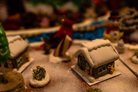 Christmas decorations against blurred background. Ginger houses with candies.の写真素材