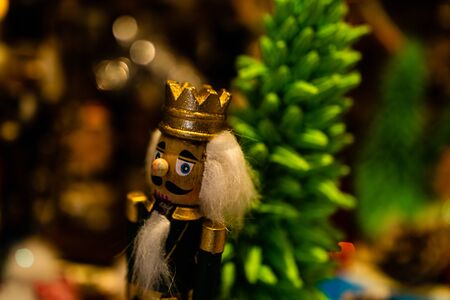 Christmas decorations against blurred background. Wooden soldier for Christmas tree.の写真素材