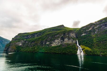 The Suitor, a waterfall in Geiranger Fjord, Norway, opposite to The Seven Sisters Waterfall.の写真素材