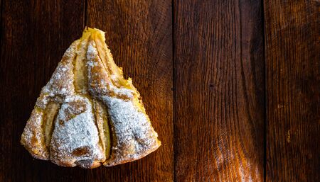 Freshly baked apple pie with sugar powder on a wooden board. Homemade apple cake.の写真素材