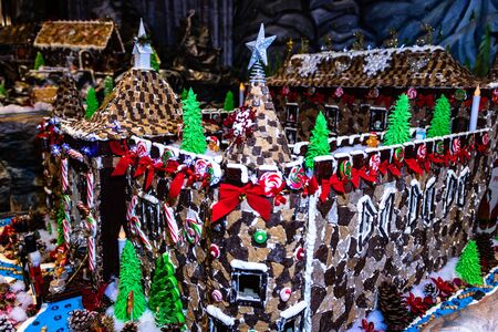 Christmas decorations against blurred background. Ginger houses with candies.の写真素材