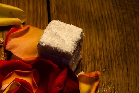 Mini cake on a wooden board. Close up photo.の写真素材