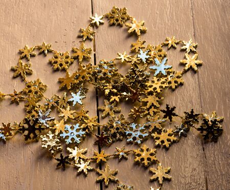 Christmas decorations on wooden board. Christmas concept.  Snowflake garland.の写真素材