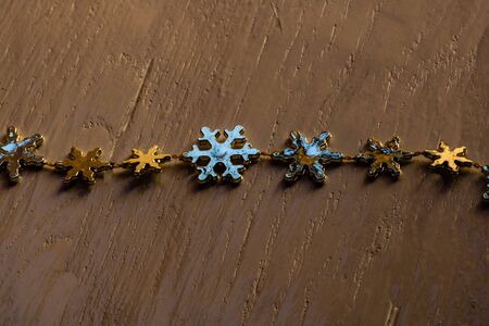 Christmas decorations on wooden board. Christmas concept.  Snowflake garland.の写真素材