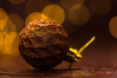 Christmas decorations against blurred background. Close up of  glittery Christmas ball. Christmas lights.の写真素材