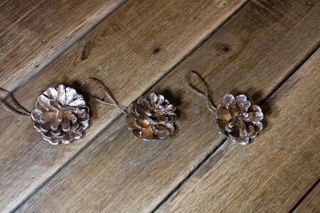 Christmas decorations on wooden board. Christmas pine cones.の写真素材