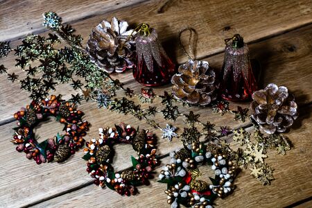 Christmas decorations on wooden board. Christmas pine cones and wreaths.の写真素材