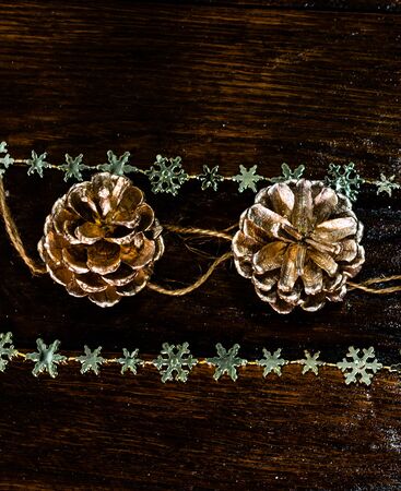 Christmas decorations on wooden board. Christmas pine cones.の写真素材