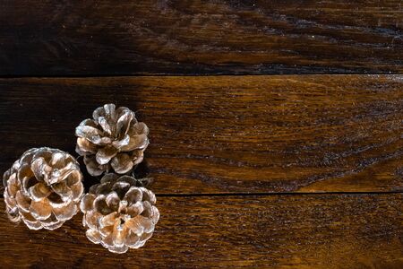 Christmas decorations on wooden board. Christmas pine cones.の写真素材