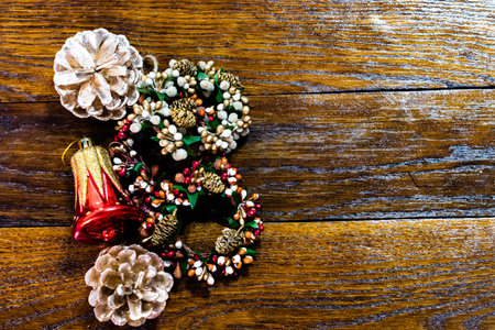Christmas decorations on wooden board. Christmas concept. Pine cone, Christmas balls and wreaths.
