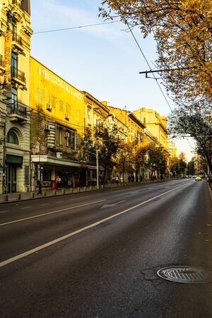 Cars on the road, old buildings on Regina Elisabeta Way in downtown Bucharest, Romania, 2019のeditorial素材