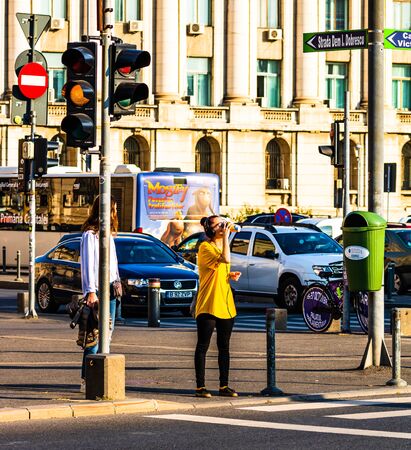 People, tourist crossing the street in downtown Bucharest, Romania, 2019のeditorial素材